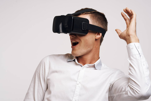 Cheerful man in a white shirt vr glasses gadget device video isolated background - Foto, Imagem
