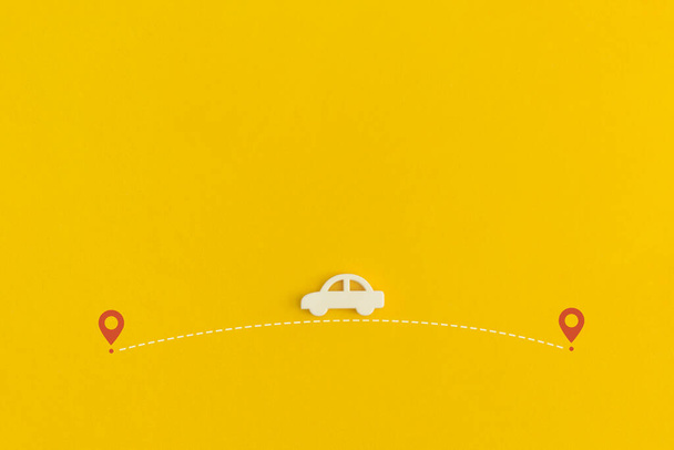 Toy car on a yellow background. Top view. Flat lay. - Фото, зображення