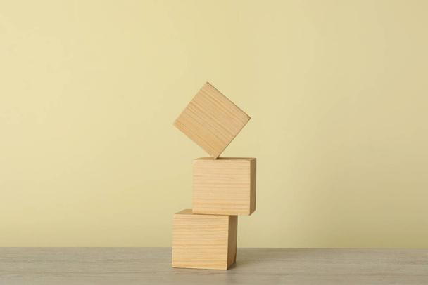 Stack of wooden cubes on table. Harmony and balance concept - Foto, Imagen