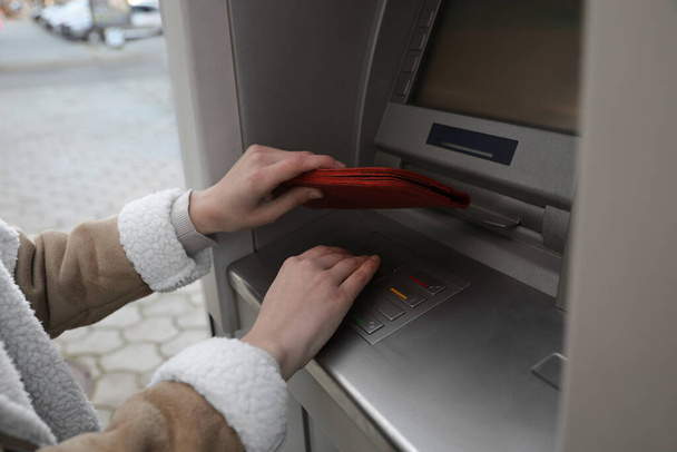 Woman entering cash machine pin code, closeup - Foto, imagen