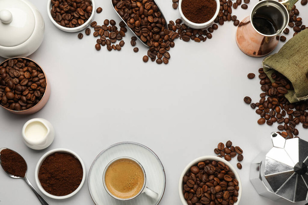 Frame of coffee grounds and roasted beans on white background, flat lay. Space for text - Fotó, kép