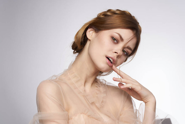 pretty woman gesture hands cosmetics fashion hairstyle posing light background - Фото, изображение