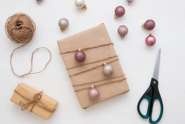 Christmas decorations and gift box on a light background. View from above. - 写真・画像