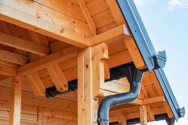 Wooden housing construction. The roof of a timber frame house. Frame modular house. - 写真・画像