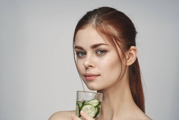 woman with cucumber drink health vitamins close-up - Foto, Imagem