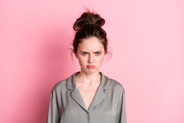 Photo of young attractive woman unhappy sad upset offended wear pajamas isolated over pink color background - Photo, image