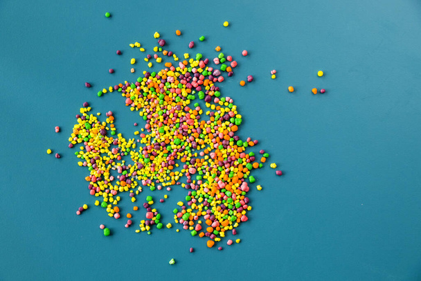 Candy on the blue table, colorful sweet candy background, high angle view - Fotografie, Obrázek