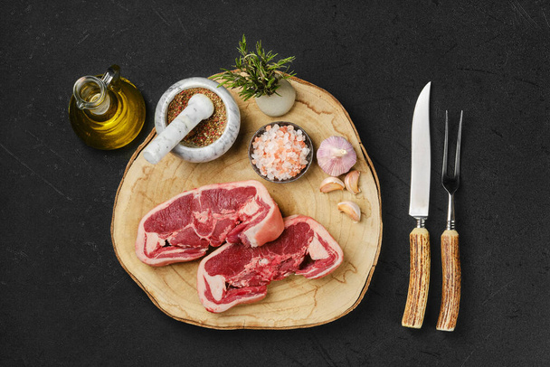 Overhead view of raw fresh lamb double loin chop ready for cooking - Fotoğraf, Görsel