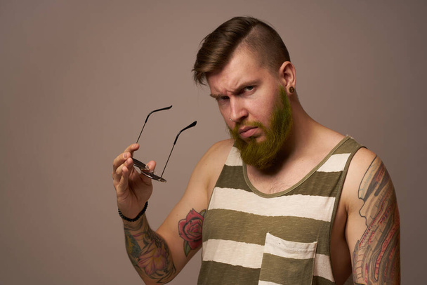 bearded man in striped t-shirt glasses tattoo on his arms fashion - Photo, Image