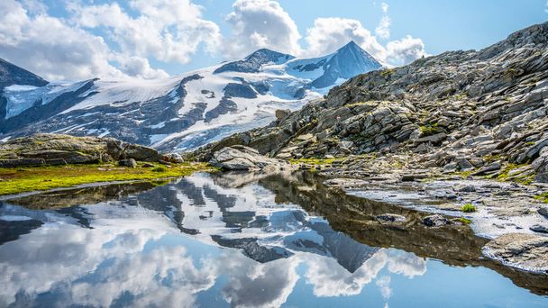 Mountain glacier reflection in Austrian Alps - Photo, image