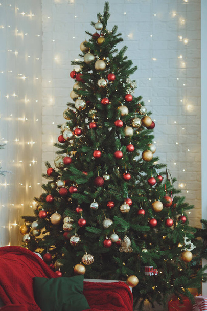 Christmas background. Christmas tree with toys and garlands. - Photo, Image