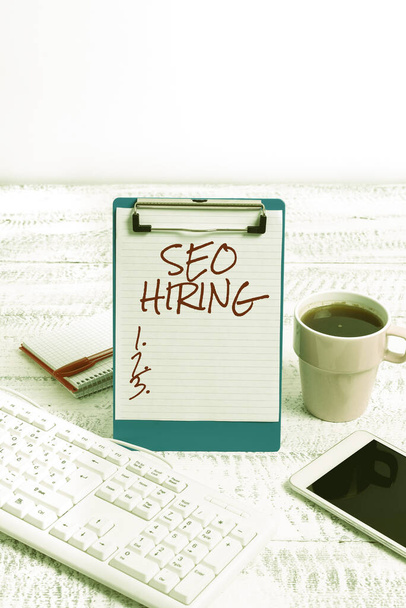 Conceptual caption Seo Hiring. Conceptual photo employing a specialist will develop content to include keywords Typing New Ideas Business Planning Idea Voice And Video Calls - Photo, Image