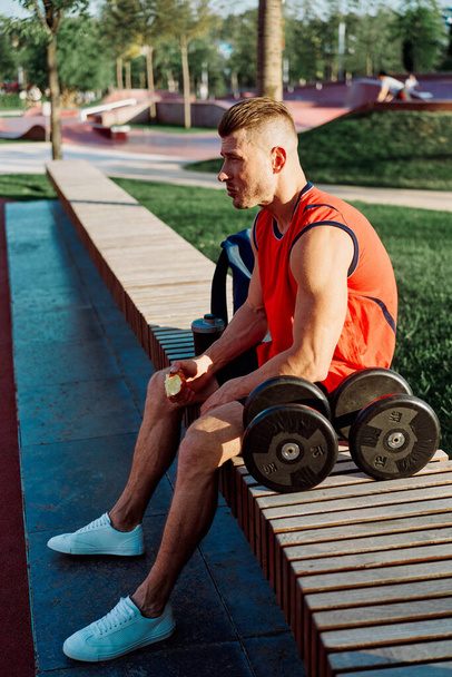 sporty man sitting on bench fitness workout lifestyle - Fotó, kép