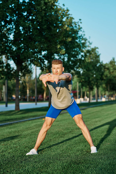 sporty man in the park on the lawn exercise lifestyle - Фото, зображення
