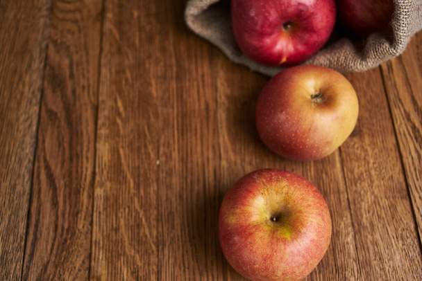 apples on a wooden table vitamins fresh fruits organic - Fotó, kép