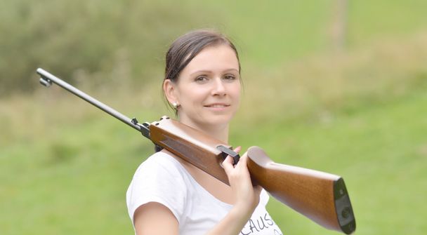 Girl aiming a pneumatic rifle - Photo, Image