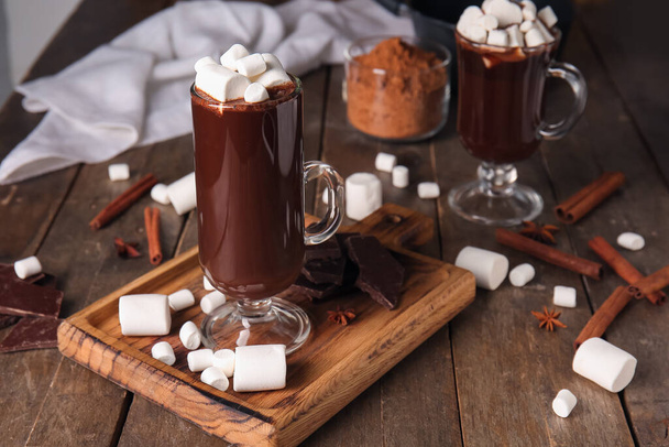 Glass cups of tasty hot chocolate with marshmallows on wooden background - Photo, Image