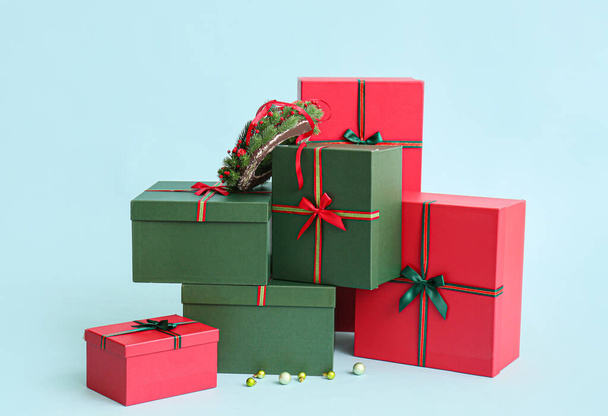 Beautiful Christmas gift boxes on blue background - Photo, image