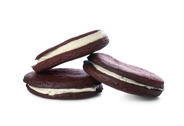 Tasty chocolate cookies with cream on white background - Фото, зображення