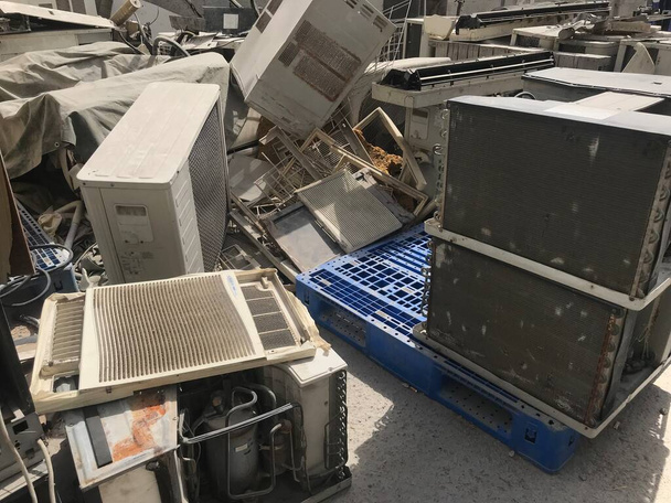 Window air conditioners are stacked randomly at go-down - Photo, Image