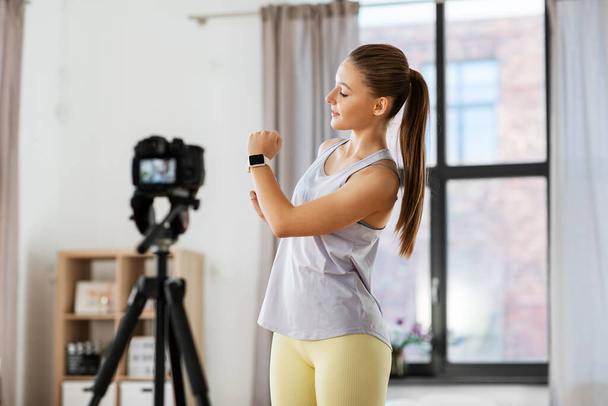 teenage girl or blogger recording gym class video - Photo, Image