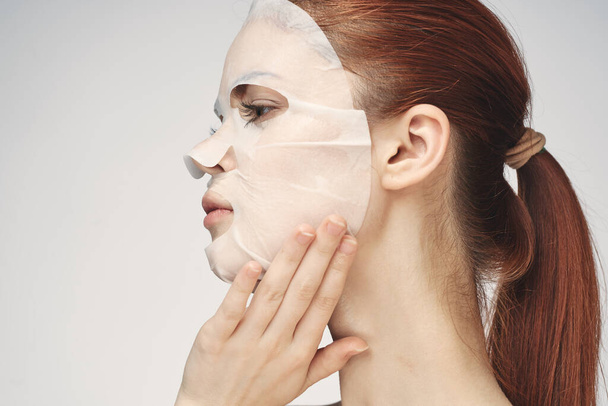 woman in cosmetic mask facial skin care rejuvenation - Photo, image