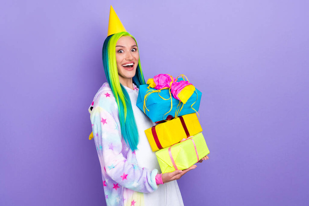Photo of funky lovely lady hold pile gifts prepare fest wear cone cap kigurumi costume isolated purple color background - Photo, Image