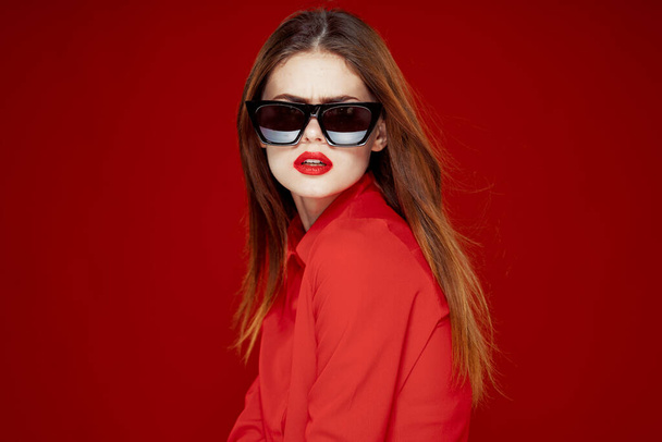 glamorous woman wearing sunglasses red shirt hairstyle model - Photo, image