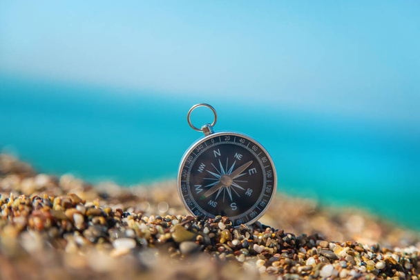 Compass on the sea beach. Selective focus. Travel. - Fotoğraf, Görsel