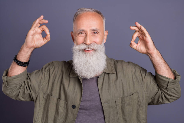 Photo of retired man show fingers okey symbol approve good nice perfect promo isolated over grey color background - 写真・画像