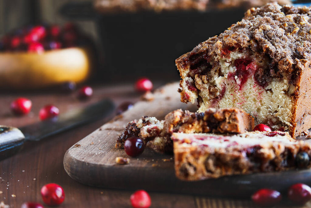 Rustic image of homemade cranberry sweet bread for Christmas. Selective focus with blurred foreground and background. - Foto, Imagen