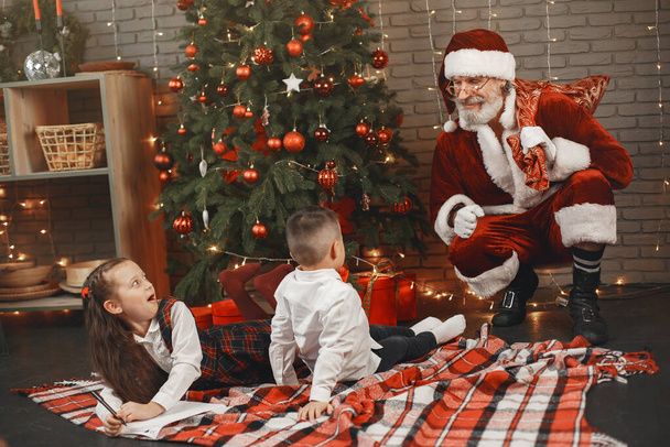 A cute children writes a letter to Santa Claus - Valokuva, kuva