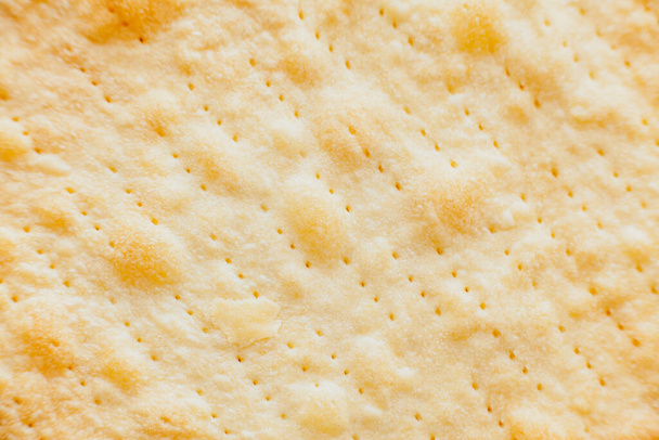 Texture of baked crumpets cakes made of puff pastry for cake. Semi-finished product for cake, close up top view - Foto, immagini