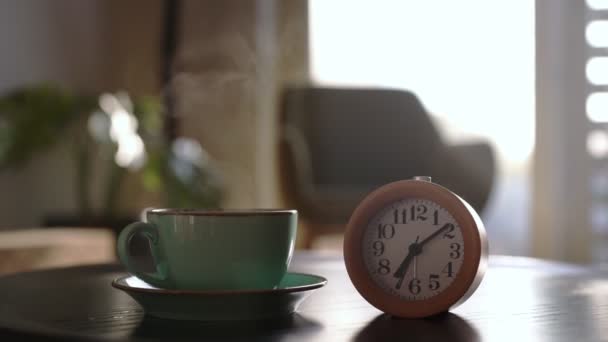 Morning at seven o'clock. Clock and a cup of tea. - Footage, Video