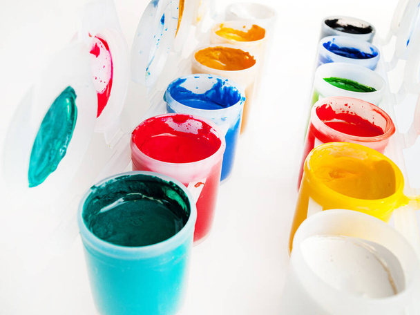 Jars with paints, close-up, acrylic, watercolor, gouache, finger, drawing and creativity, hobbies and recreation - 写真・画像