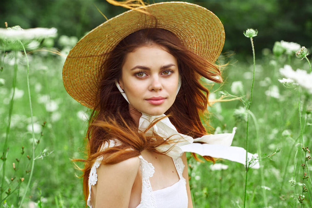 pretty woman with hat nature field flowers fresh air - Foto, Imagem