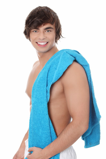Young man in a towel. - Zdjęcie, obraz