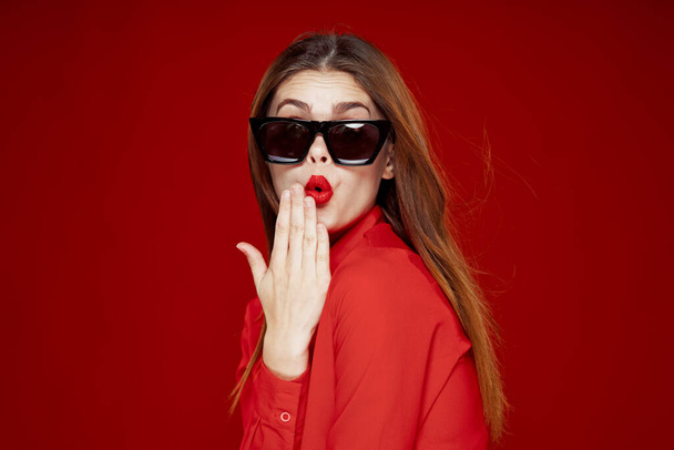 glamorous woman wearing sunglasses red shirt hairstyle model - Photo, Image