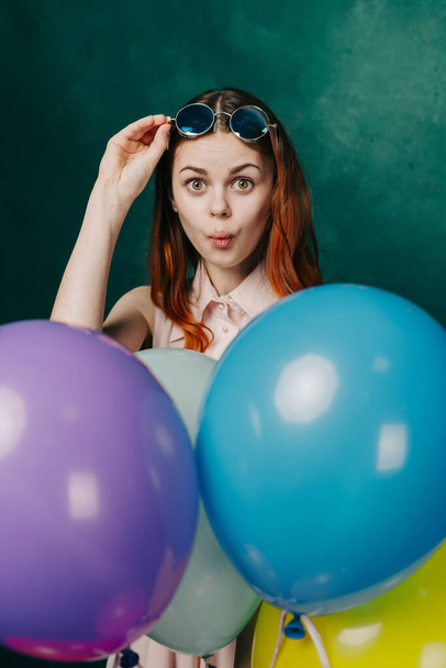 woman wearing fashionable glasses balloons holiday entertainment - Foto, Imagen