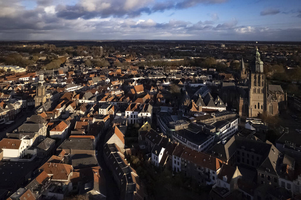Aerial view of picturesque tower town Zutphen in The Netherlands with the Walburgiskerk church towering over the historic facades and rooftops - Fotoğraf, Görsel