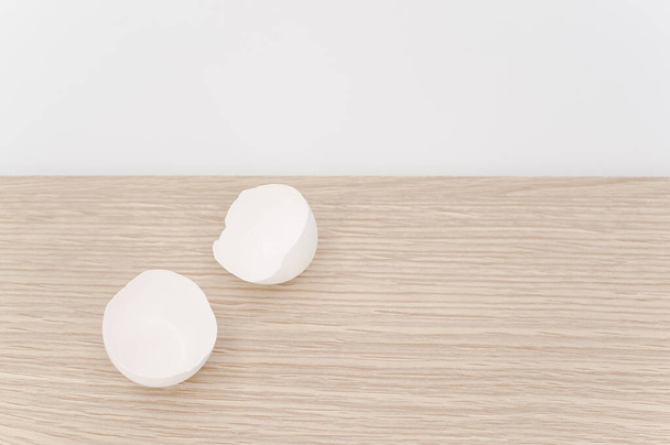 organic white egg shells on a natural wooden tabletop surface with copy space for text - Фото, изображение