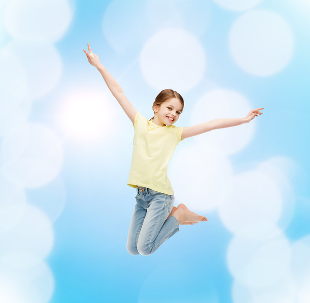 smiling little girl jumping - Fotó, kép