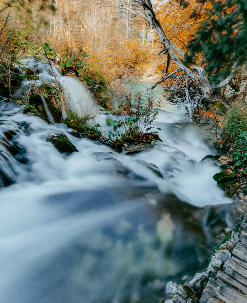 A long exposure photo of cascades at famous Plitvice Lakes National Park in Croatia in autumn - Foto, Imagen