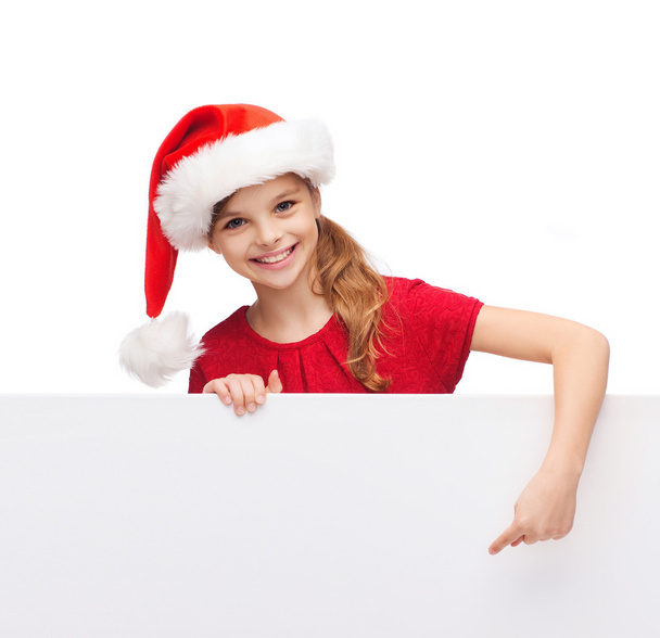 child in santa helper hat with blank white board - 写真・画像