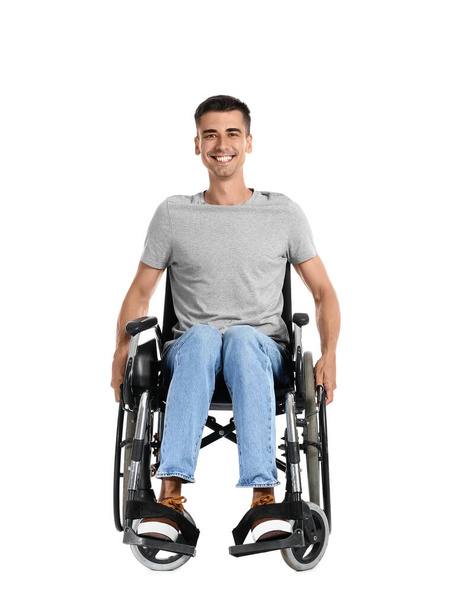 Young man in wheelchair on white background - Foto, Bild