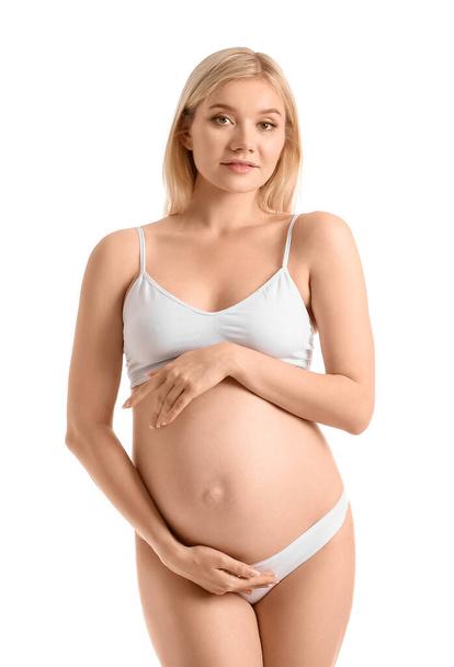 Hermosa mujer embarazada sobre fondo blanco - Foto, imagen