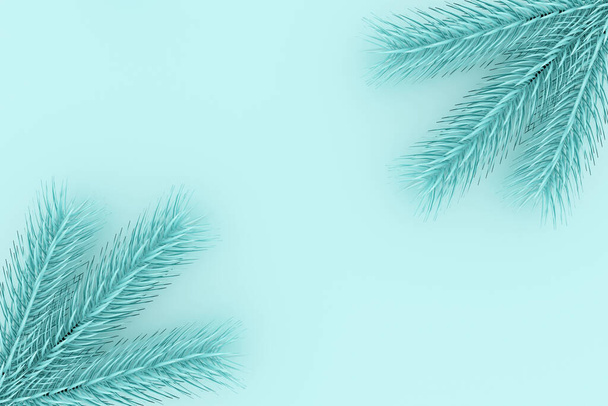 Neujahrs- und Weihnachtsdekor mit blauem Hintergrund und freiem Platz zum Einfügen. Zweige von Blaufichten auf blauem Grund. 3D-Renderer. - Foto, Bild