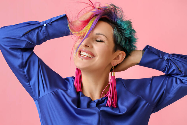 Beautiful woman with unusual hair on color background - 写真・画像