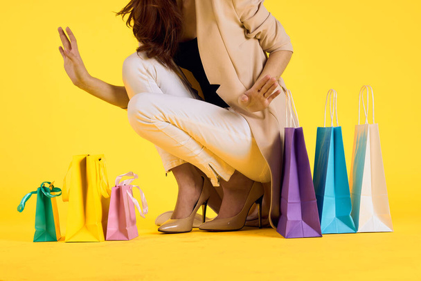glamorous woman multicolored packs emotions shopping fashion isolated background - Foto, immagini