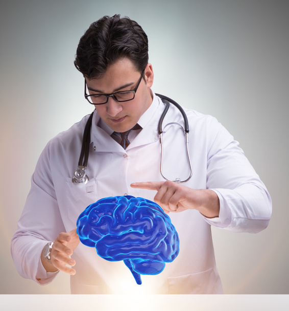 Médico varón con cerebro en concepto médico - Foto, Imagen